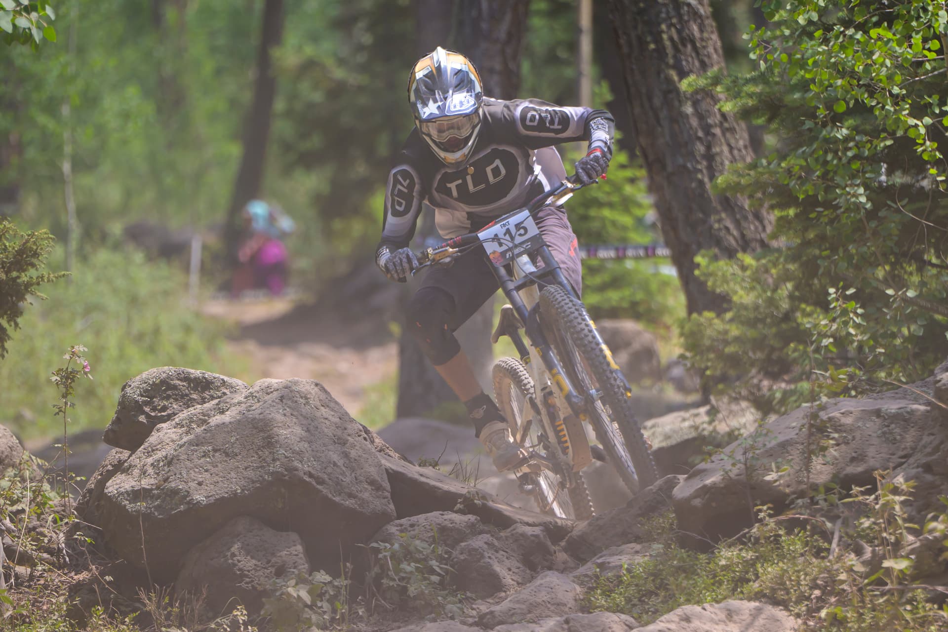 Nico Pfeifer attacking a rock garden in the trees